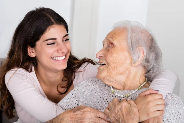 Grandmother And Daughter Embracing Each Other