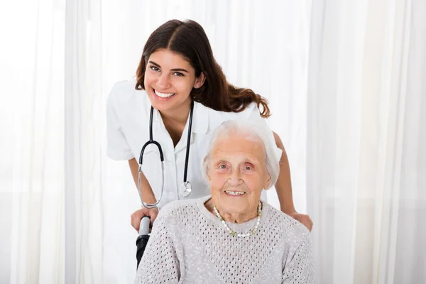 Doctor With Handicapped Senior Patient