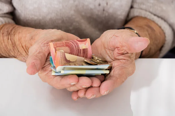 Senior Woman Showing Money
