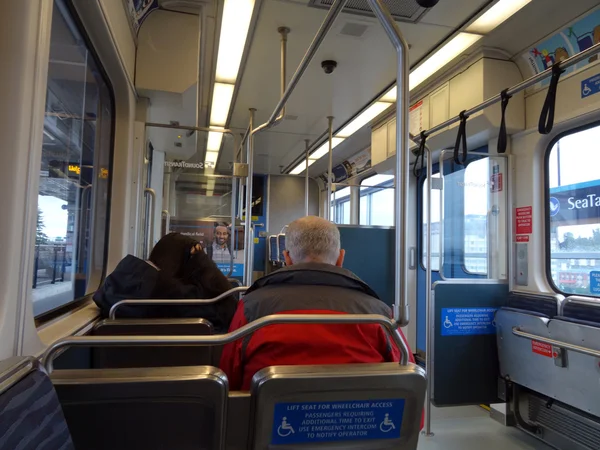 People ride Sound Transit light rail train