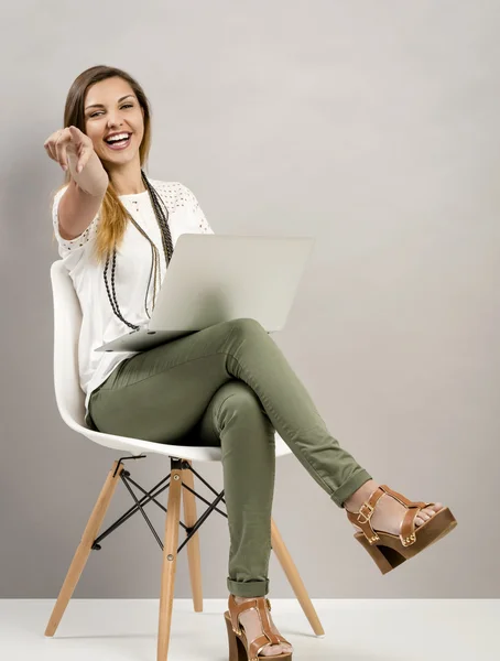 Pretty woman posing in white blouse