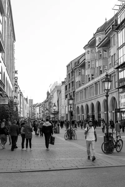 MUNICH, GERMANY-April 29: Street view of Tourists on foot Street