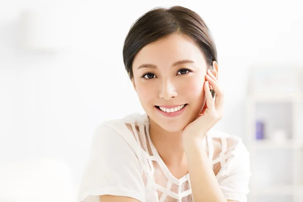 Closeup smiling young asian woman face