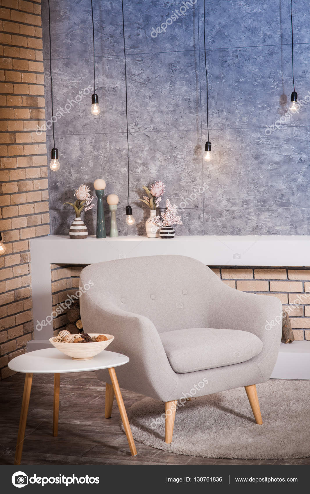 Moderner grauer stuhl im loft stil zimmer verzierten lampen vor dem ziegel und beton wand hintergrund foto von favorekyiv gmail com