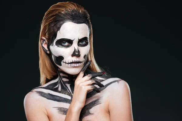 Young woman with gothic skeleton makeup