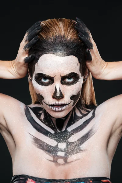 Woman with skeleton halloween makeup