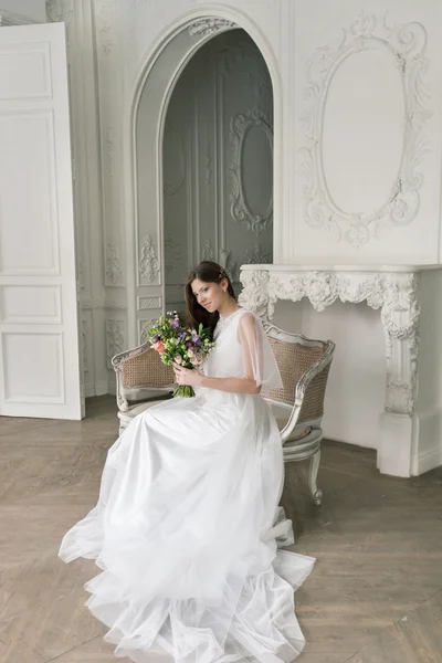 Bride. Young women with wedding dress in very bright room, some