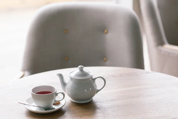 Still life details, cup of tea on a coffee table in living room