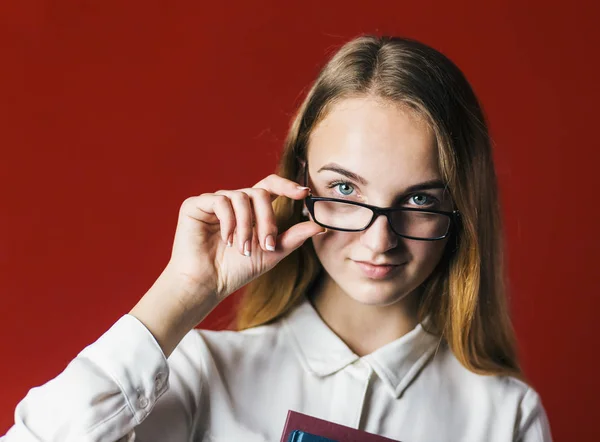 Attractive Student Blonde Girl with Glasses on Red
