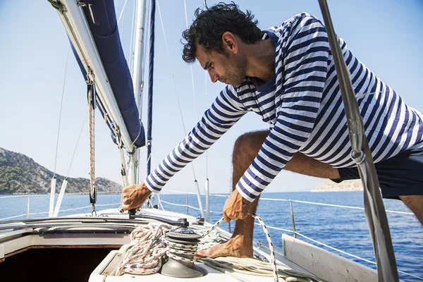 Man in action of pulling rope