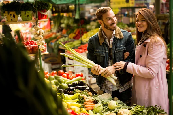 Couple at food market