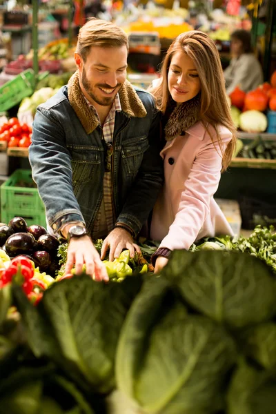 Young couple at market
