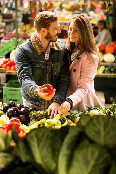 Young couple at market