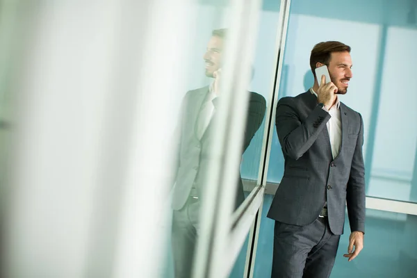 Young businessman with mobile phone