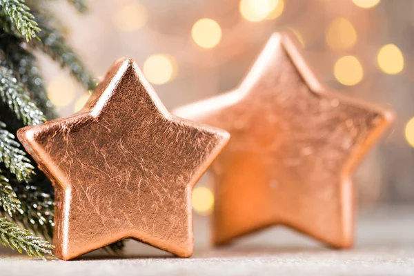 Christmas bronze decoration. Holiday decorations bronze on bokeh