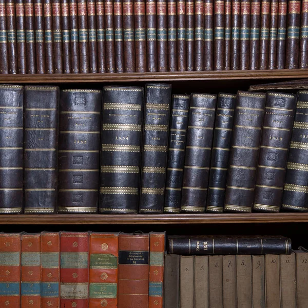 Old books in wooden row library