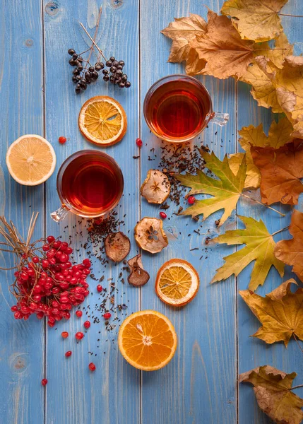 Transparent cup of hot tea with lemon. autumn conception