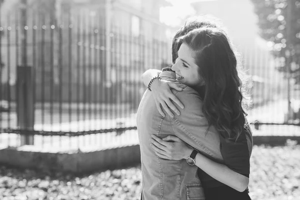 Couple in love hugging in city