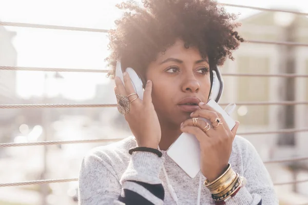 Afro woman listening music