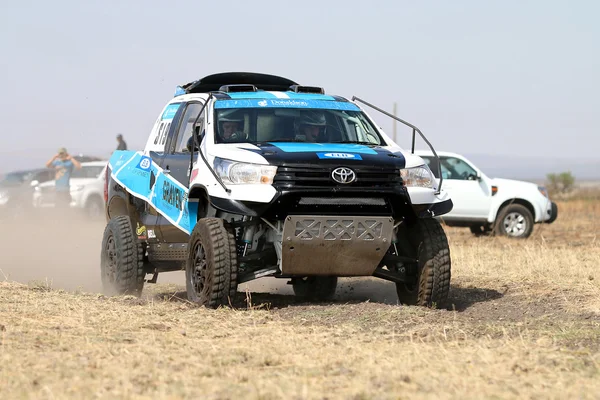 Close-up view of Speeding white and blue Toyota Hilux twin cab r