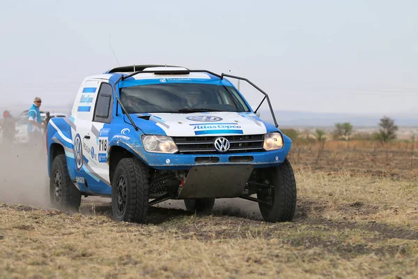 Close-up view of Speeding blue and white VW Amarok twin cab rall