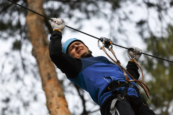 Man on a difficult course in an adventure park