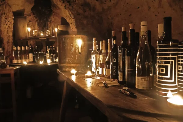 Wine-tasting in cave.