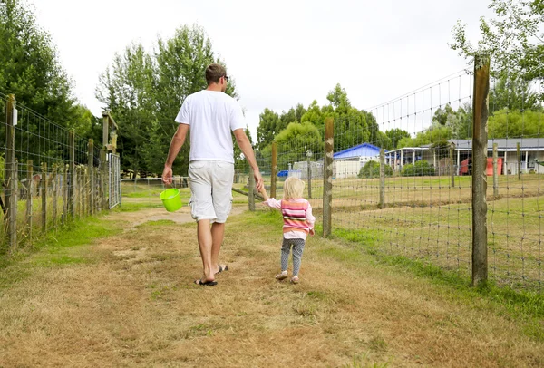 Father with daughter observing the farmland area. New Zealand