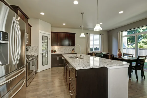 Large kitchen island in modern open plan kitchen