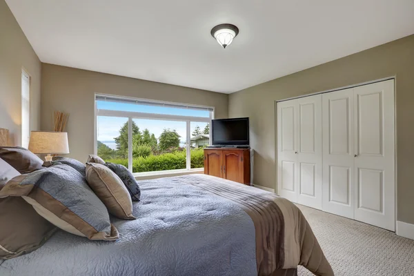 Elegant bedroom interior with soft blue bed