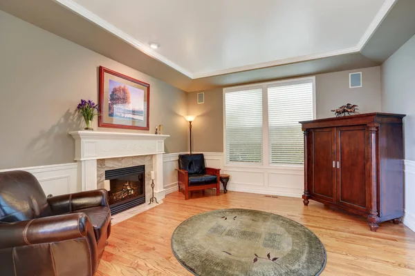 Cozy family room with vintage cabinet and fireplace