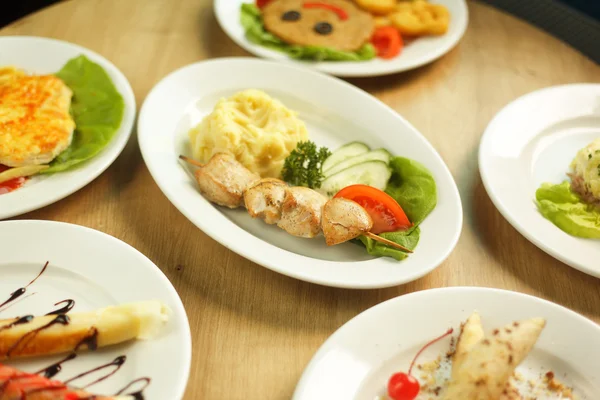 wide variety of dishes on the table in the restaurant for   children