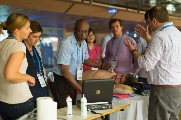Participants learning new ultrasound techniques on medical congress.