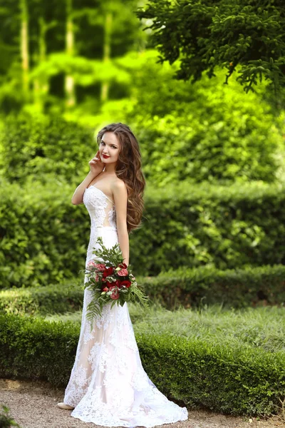 Wedding Portrait Of Beautiful Bride with long wavy hair wearing