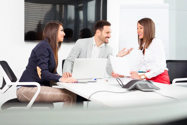 Business people in office holding a conference and discussing strategies