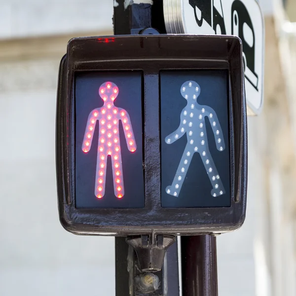 Red traffic light for pedestrians in paris