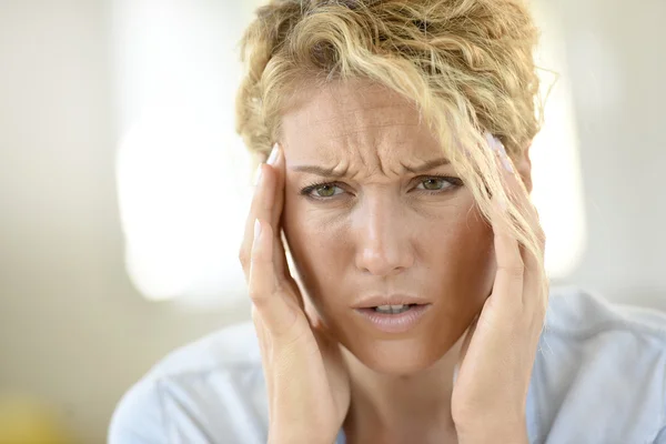 Woman suffering headache