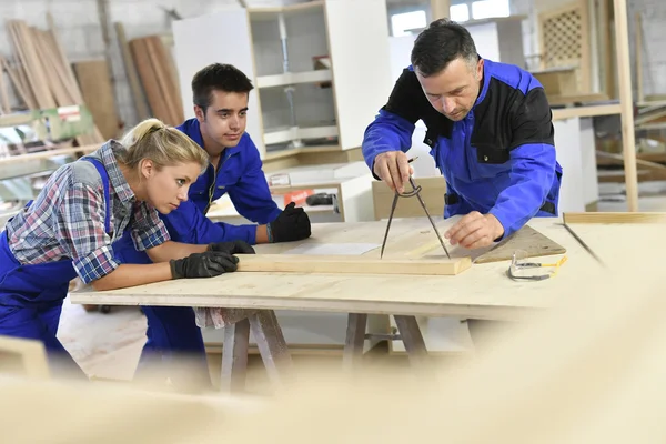 Students in woodwork training course
