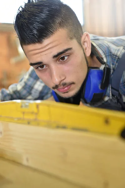 Man in woodwork training course