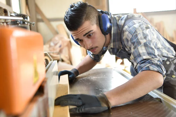 Man in woodwork training course
