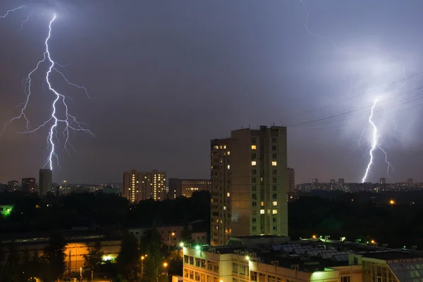 Two lightning in night sky in the city