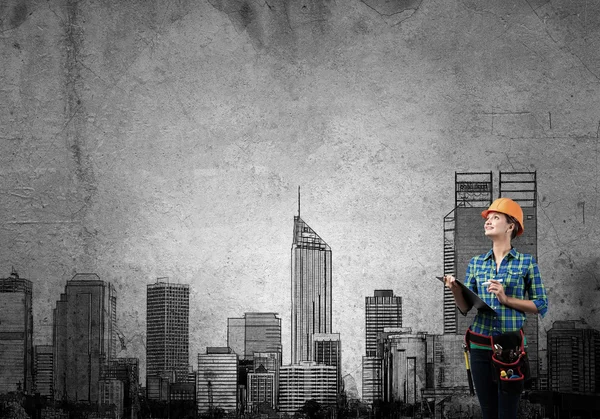 Woman with folder and sketches of construction project