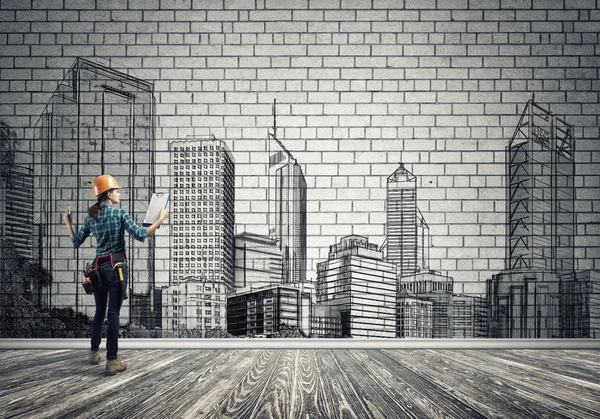 Woman with folder and sketches of construction project