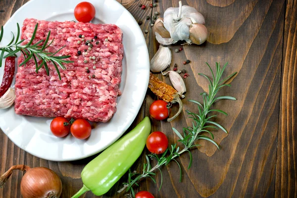 Fresh ground beef meat with seasonings (spices)