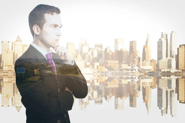 Side portrait of handsome thoughtful businessman on city background. Brainstorming concept. Double expoure