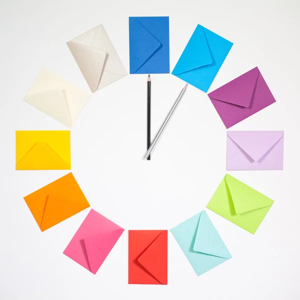 Clock of colored envelopes for Christmas mailing.