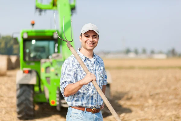 Young farmer in meadow