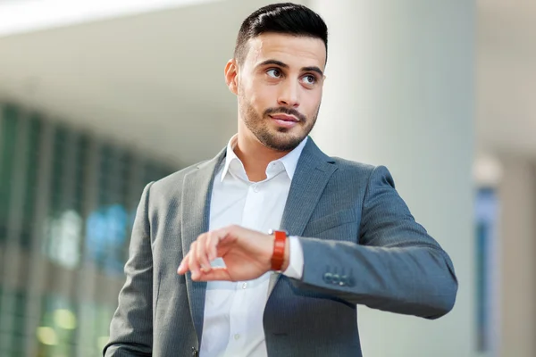 Businessman watching wrist watch