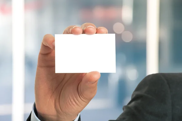 Businessman showing an empty business card