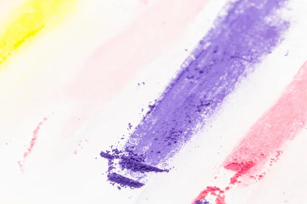 Purple pastel chalk powdered pigment closeup, on white background